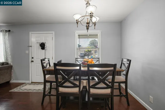 a view of a dining room with furniture and window