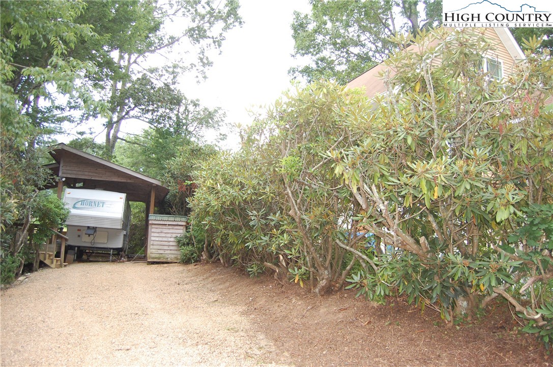 a view of a house with a yard and garage