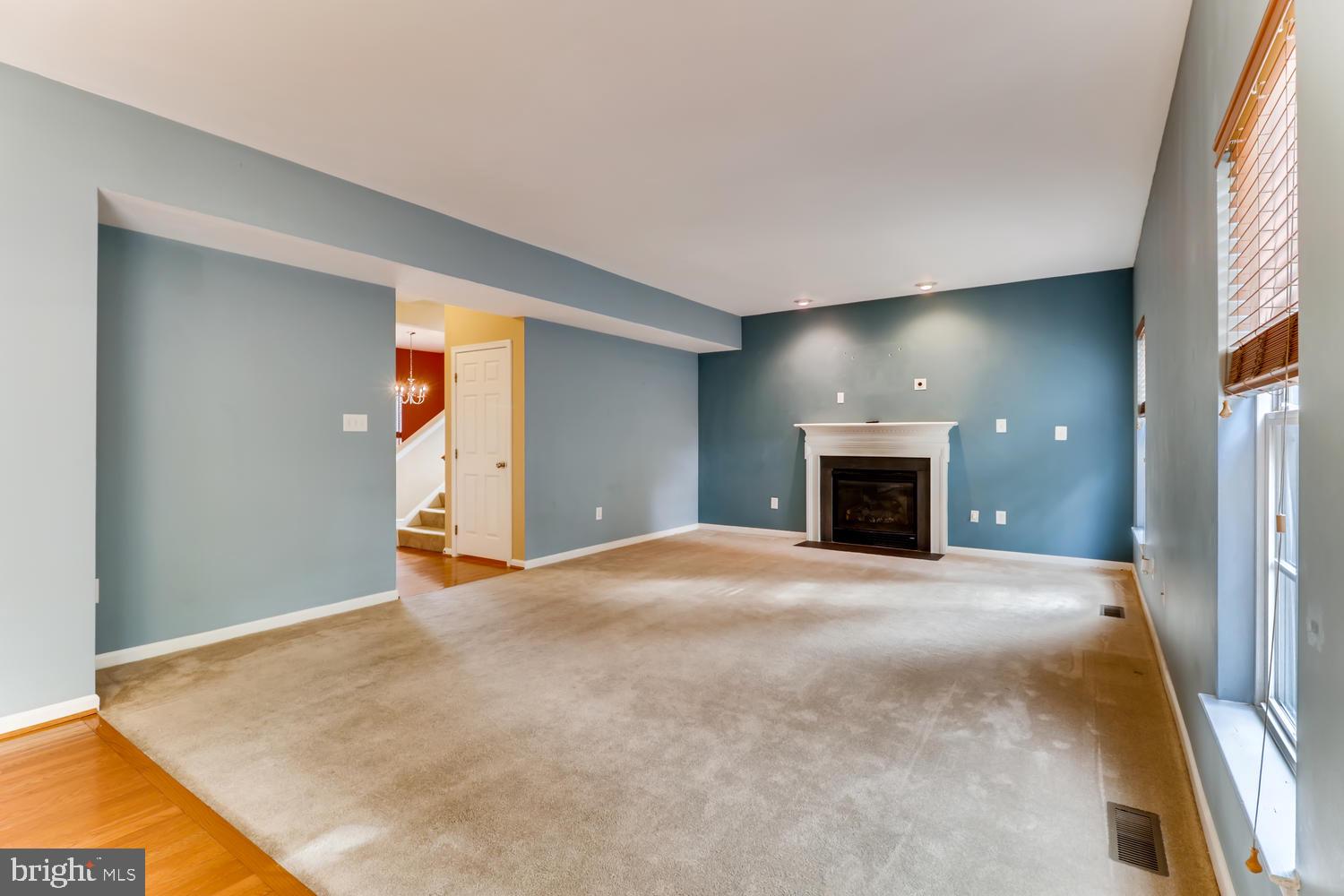 11513 Lipscomb Way White Marsh, MD 21162 - Photo 6 of 36 Spacious family room / woodburning fireplace