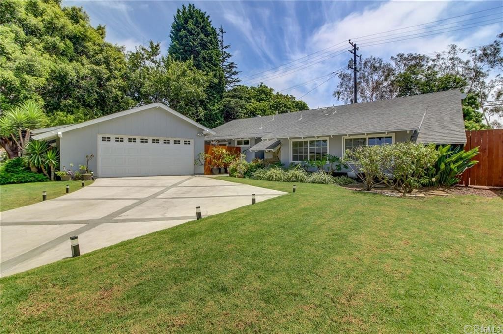 2814 Serang Place Costa Mesa, CA 92626 - Photo 2 of 28 a front view of a house with garden