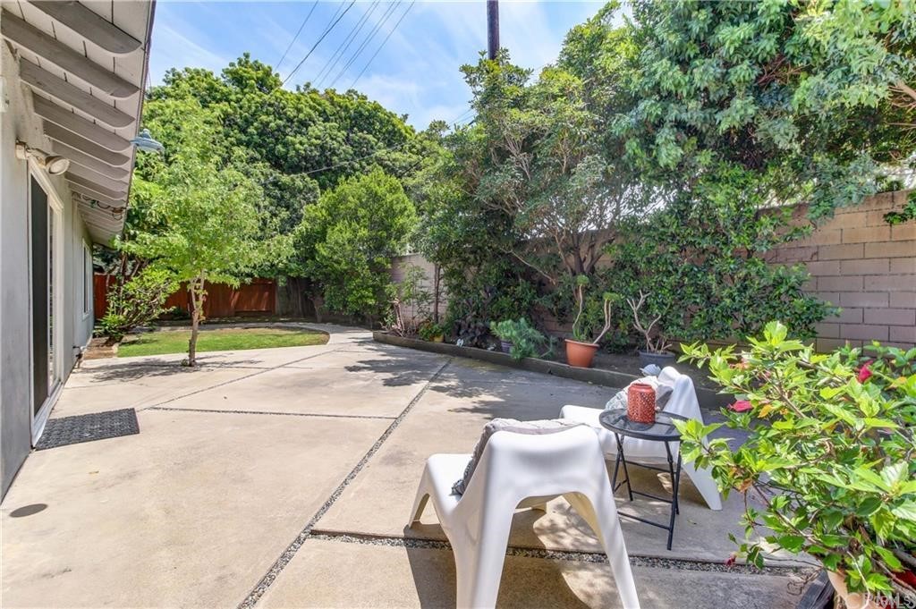 2814 Serang Place Costa Mesa, CA 92626 - Photo 28 of 28 a backyard with plants and tree