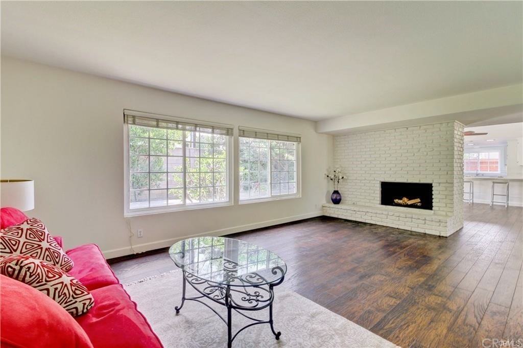 2814 Serang Place Costa Mesa, CA 92626 - Photo 6 of 28 a view of a livingroom with furniture and a fireplace