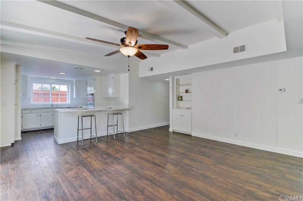 2814 Serang Place Costa Mesa, CA 92626 - Photo 10 of 28 a view of an empty room with window and wooden floor