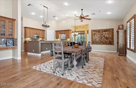 a dining room with furniture and window