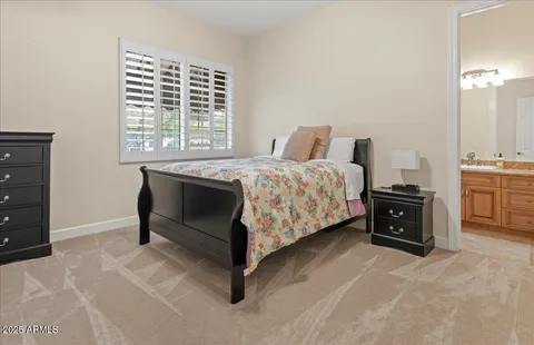 a bed room with a bed and a tv