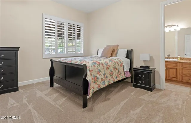 a bed room with a bed and a tv