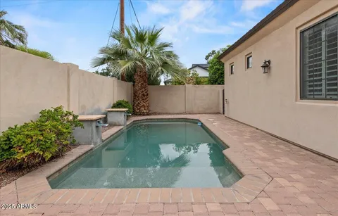 a view of a swimming pool with a patio