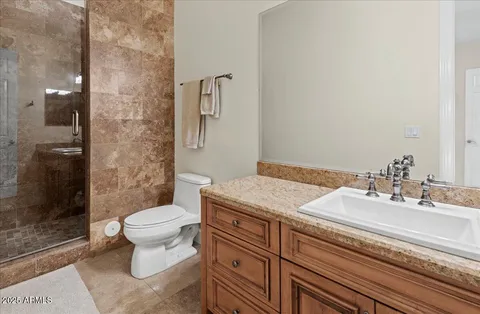 a kitchen with stove top oven sink and cabinets