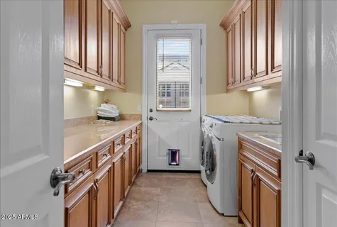 a living room with a bed furniture and a ceiling fan