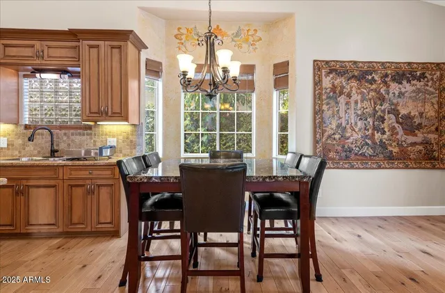 a front view of a building with potted plants