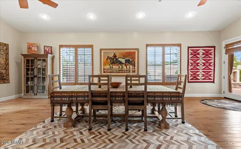a living room with furniture window and wooden floor