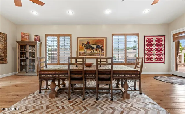 a living room with furniture window and wooden floor