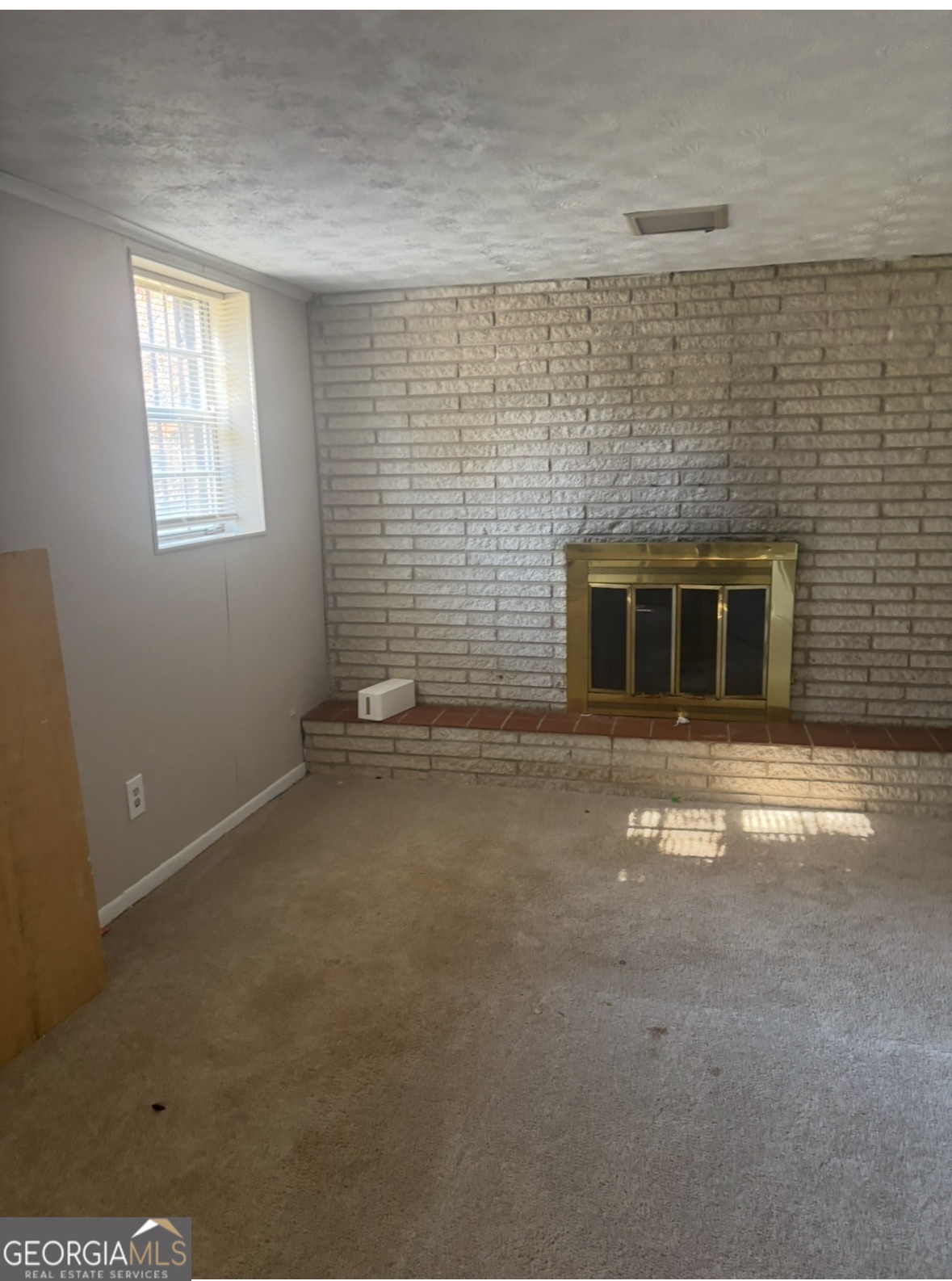 602 Dixon Road Jonesboro, GA 30238 - Photo 2 of 4 a view of empty room with a fireplace