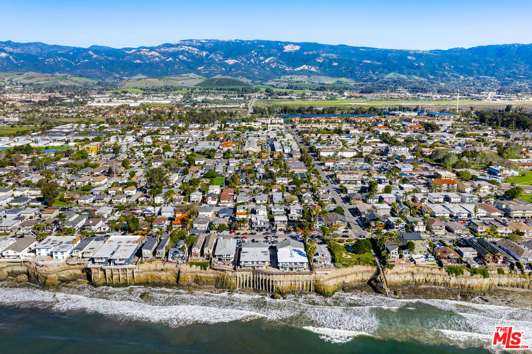 6615 Sabado Tarde Road Goleta, CA 93117 - Photo 13 of 13 a view of a town with mountains in the background