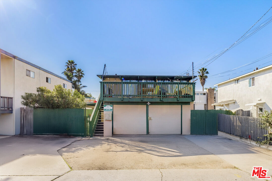 6615 Sabado Tarde Road Goleta, CA 93117 - Photo 5 of 13 a front view of a house with a yard and garage
