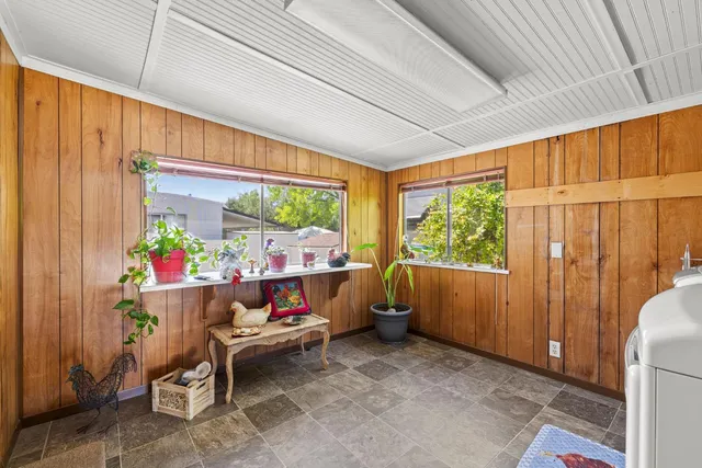 a view of a chairs and table in patio