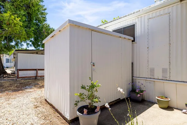 a view of house with backyard space and garden