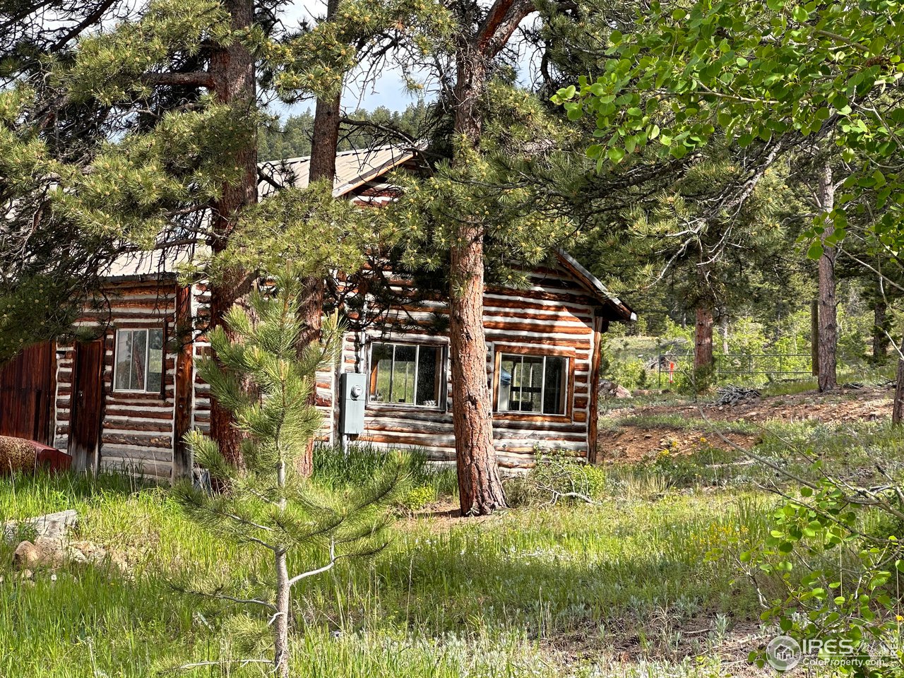 16950 Highway 7 Lyons, CO 80540 - Photo 7 of 9 a front view of a house with a yard