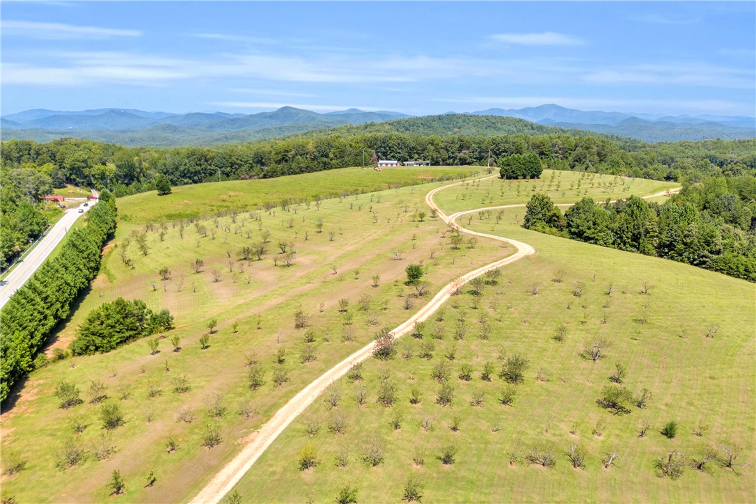 498 Raines Road Mountain Rest, SC 29664 - Photo 18 of 48 Rolling green hills and distant mountain ridges frame this expansive rural acreage.