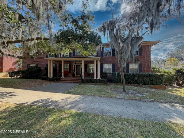 front view of a house with a yard