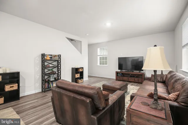 a dining room with stainless steel appliances granite countertop a dining table and chairs