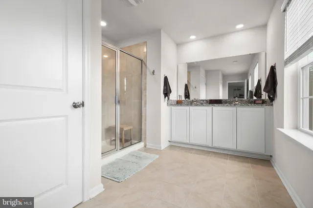 a bedroom with a bed and a television