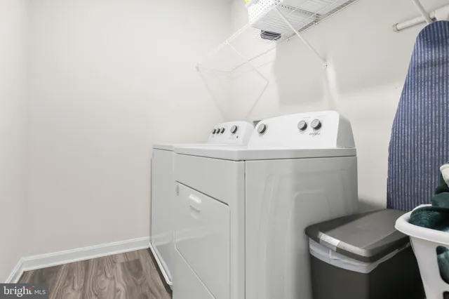 a bathroom with a granite countertop sink and mirror