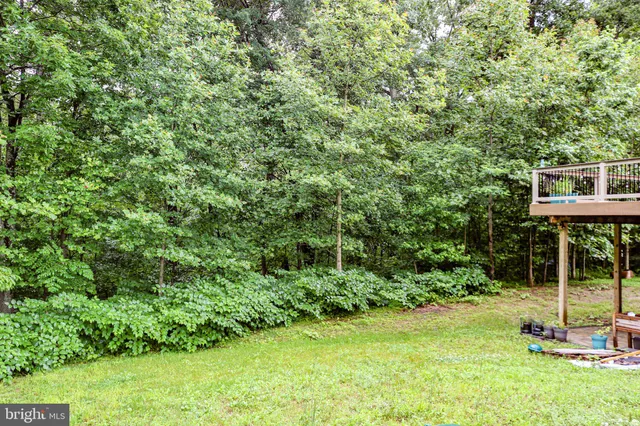 a view of balcony with deck and wooden floor