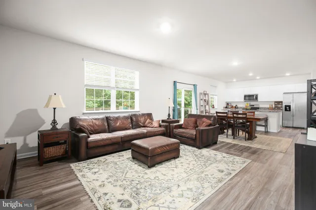a kitchen with granite countertop counter top space and living room