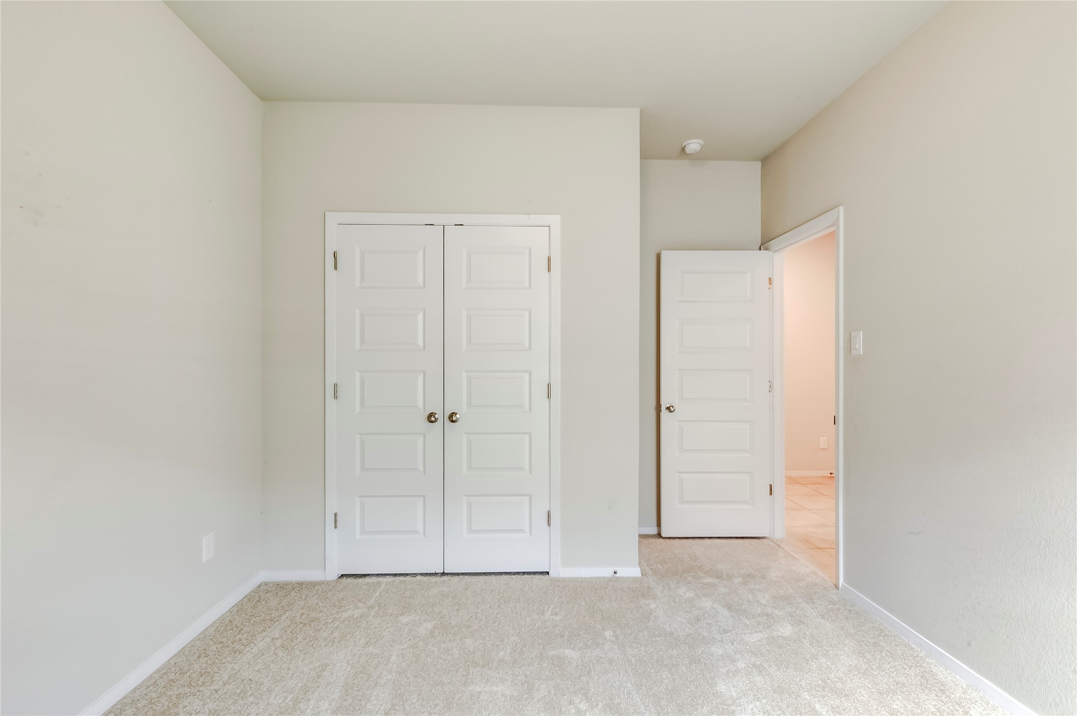2721 Winding Creek Road Kyle, TX 78640 - Photo 20 of 27 Neutral-toned carpet flooring and light wall paint