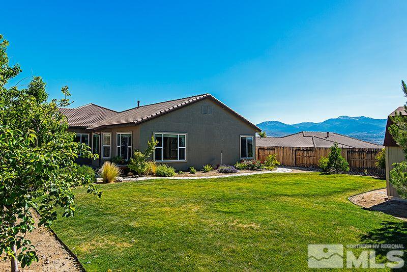 10345 Cavalry Circle Reno, NV 89521 - Photo 17 of 24 a backyard of a house with yard table and chairs
