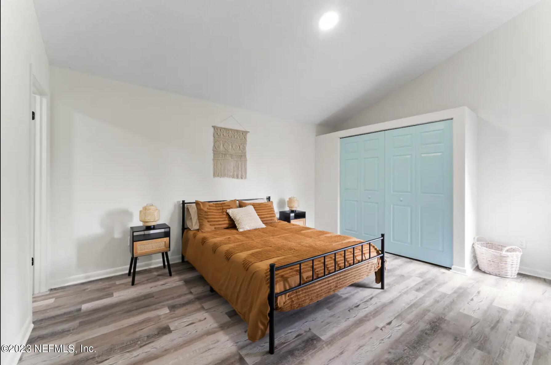 10711 Alden Road, Unit 4 Jacksonville, FL 32246 - Photo 13 of 18 a bedroom with a bed and a table