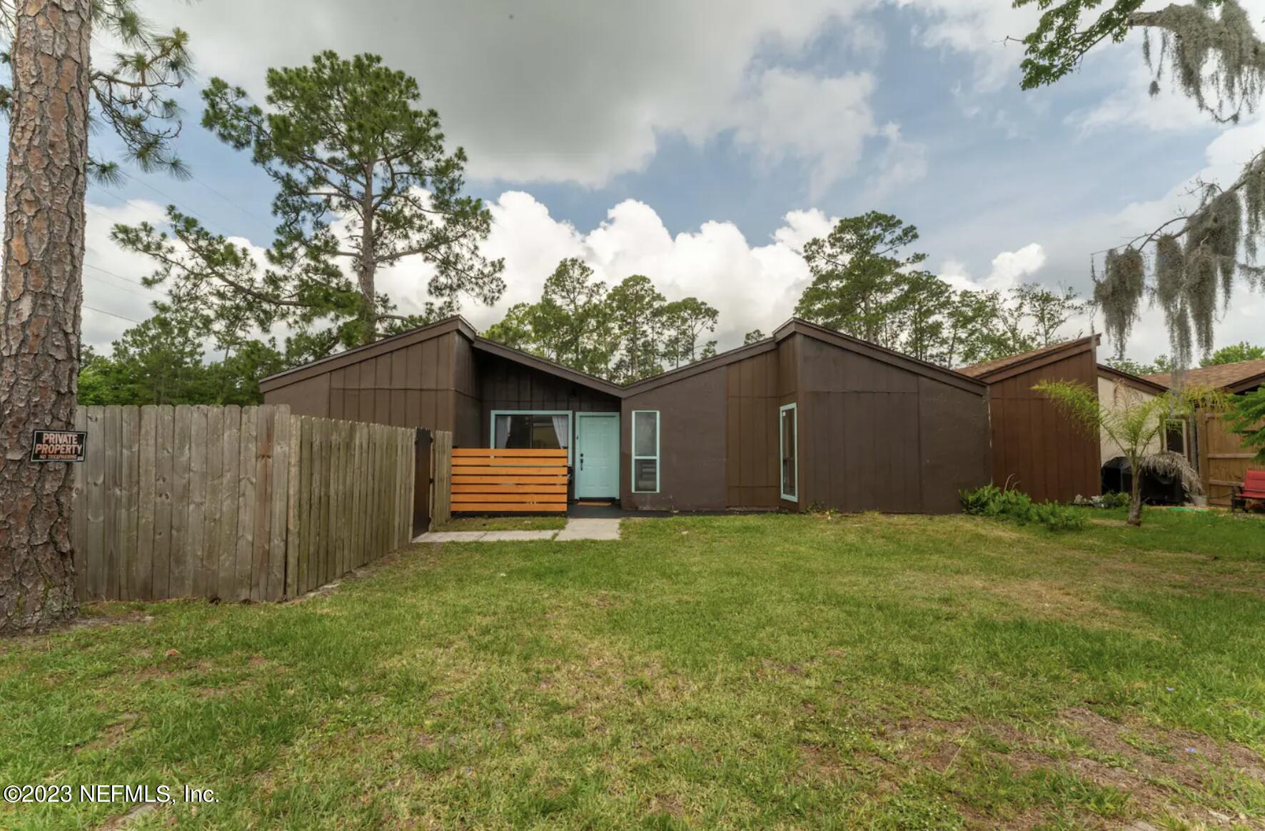 10711 Alden Road, Unit 4 Jacksonville, FL 32246 - Photo 17 of 18 a house view with a garden space