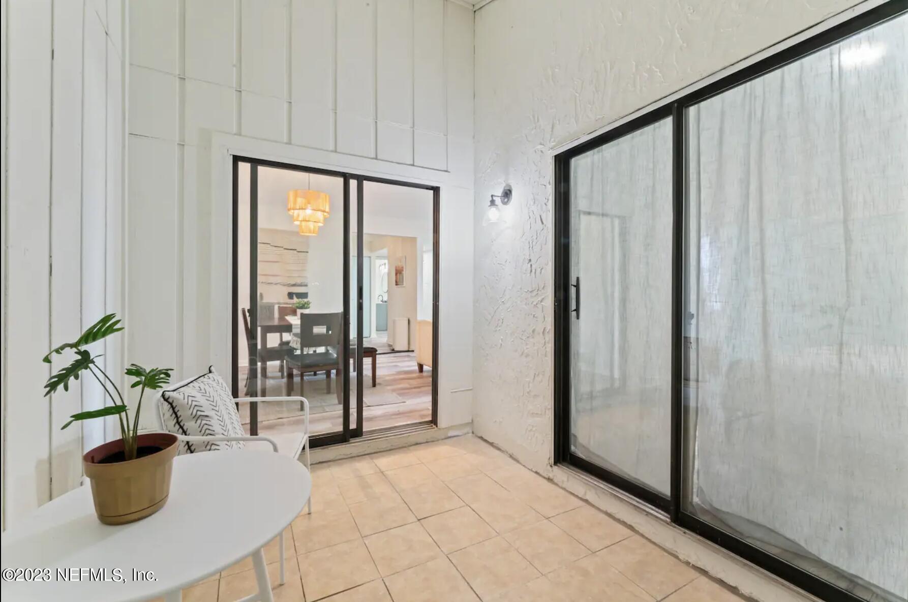 10711 Alden Road, Unit 4 Jacksonville, FL 32246 - Photo 18 of 18 a view of a living room and floor to ceiling window
