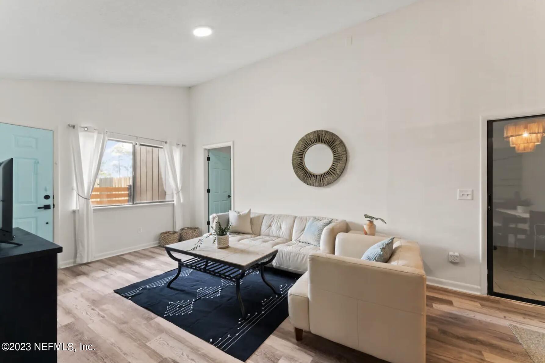 10711 Alden Road, Unit 4 Jacksonville, FL 32246 - Photo 5 of 18 a living room with furniture and a window