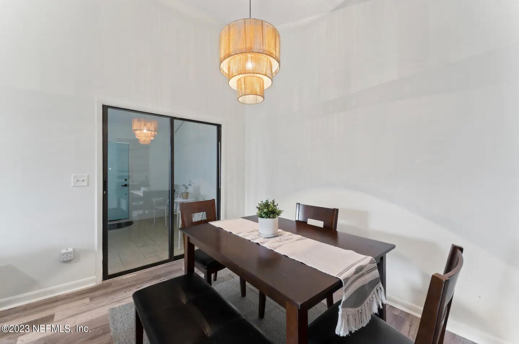 10711 Alden Road, Unit 4 Jacksonville, FL 32246 - Photo 7 of 18 a view of a dining room with a table and chairs