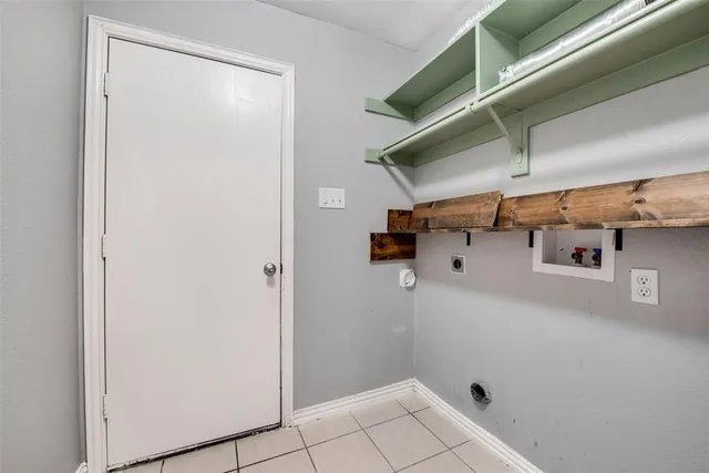 a view of storage and utility room with racks on the wall