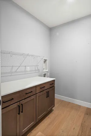 a view of a kitchen with cabinets