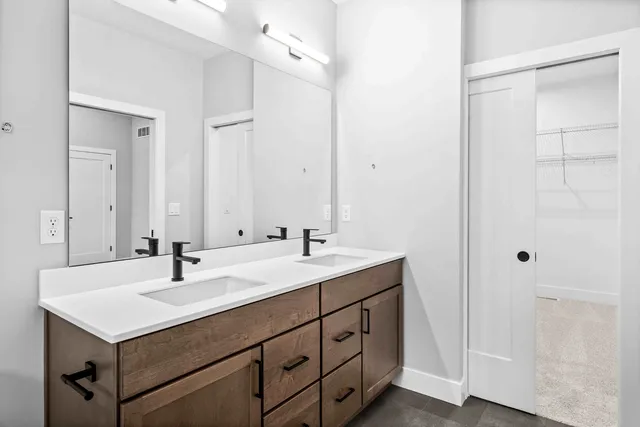 a bathroom with a sink and a mirror