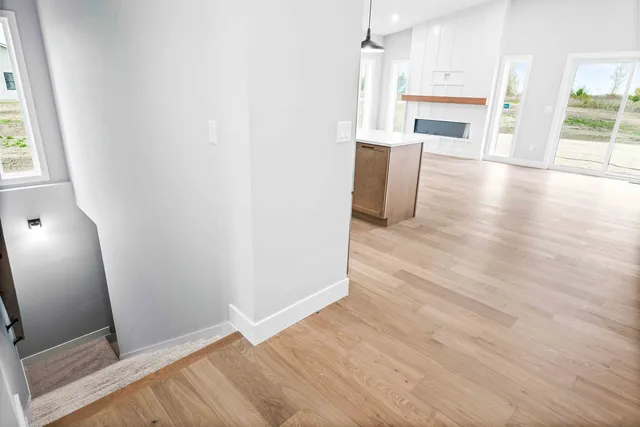 a view of kitchen with furniture and wooden floor