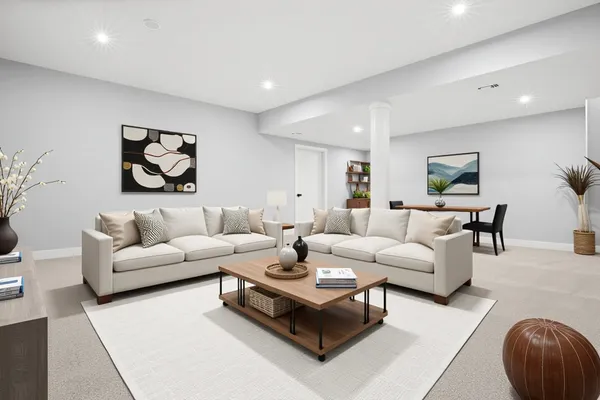 a living room with furniture and a rug