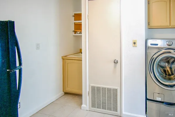 a view of a hallway with washer and dryer