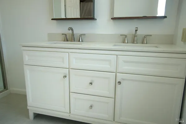 a bathroom with a sink and cabinets