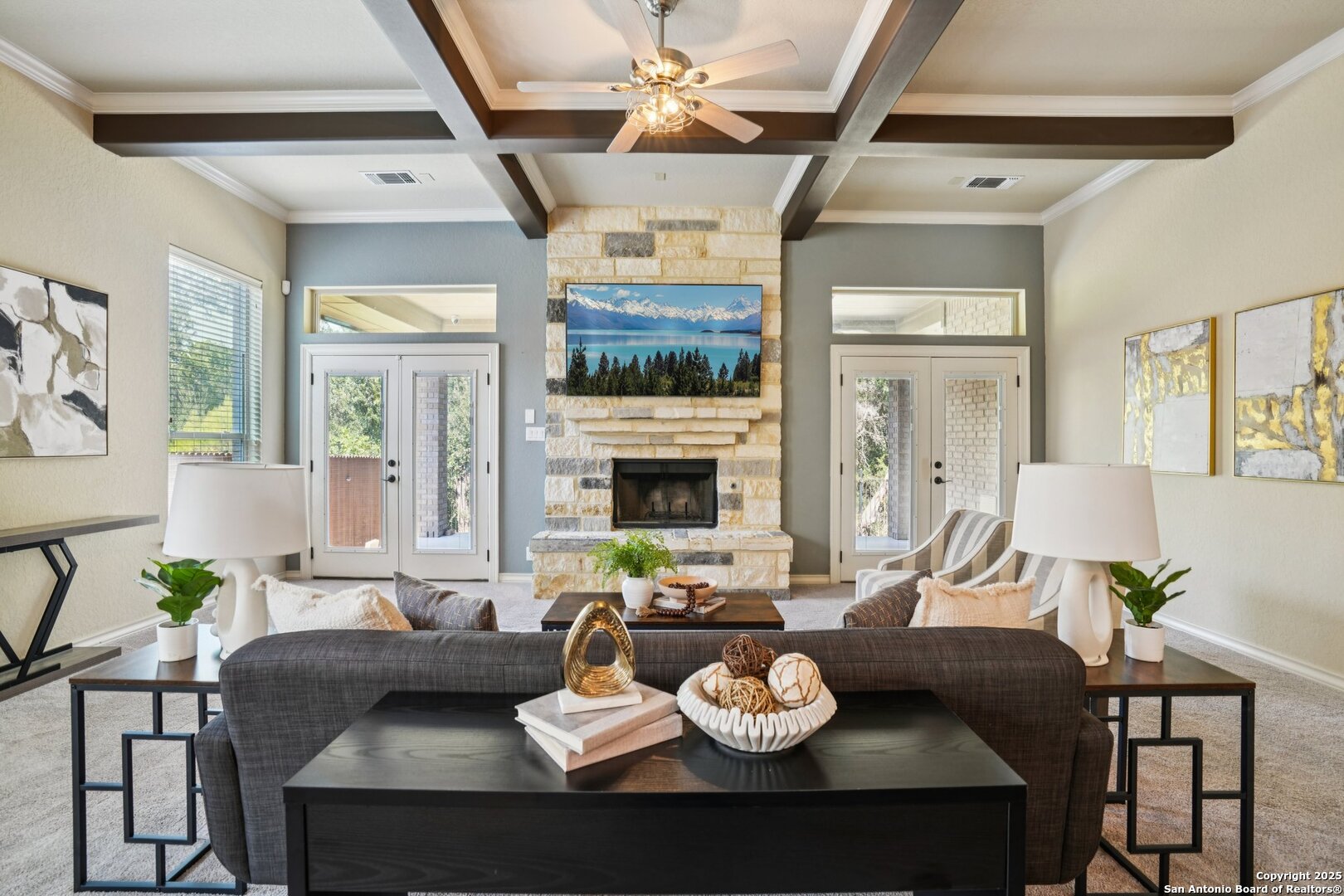 a view of a dining room with furniture a chandelier and wooden floor