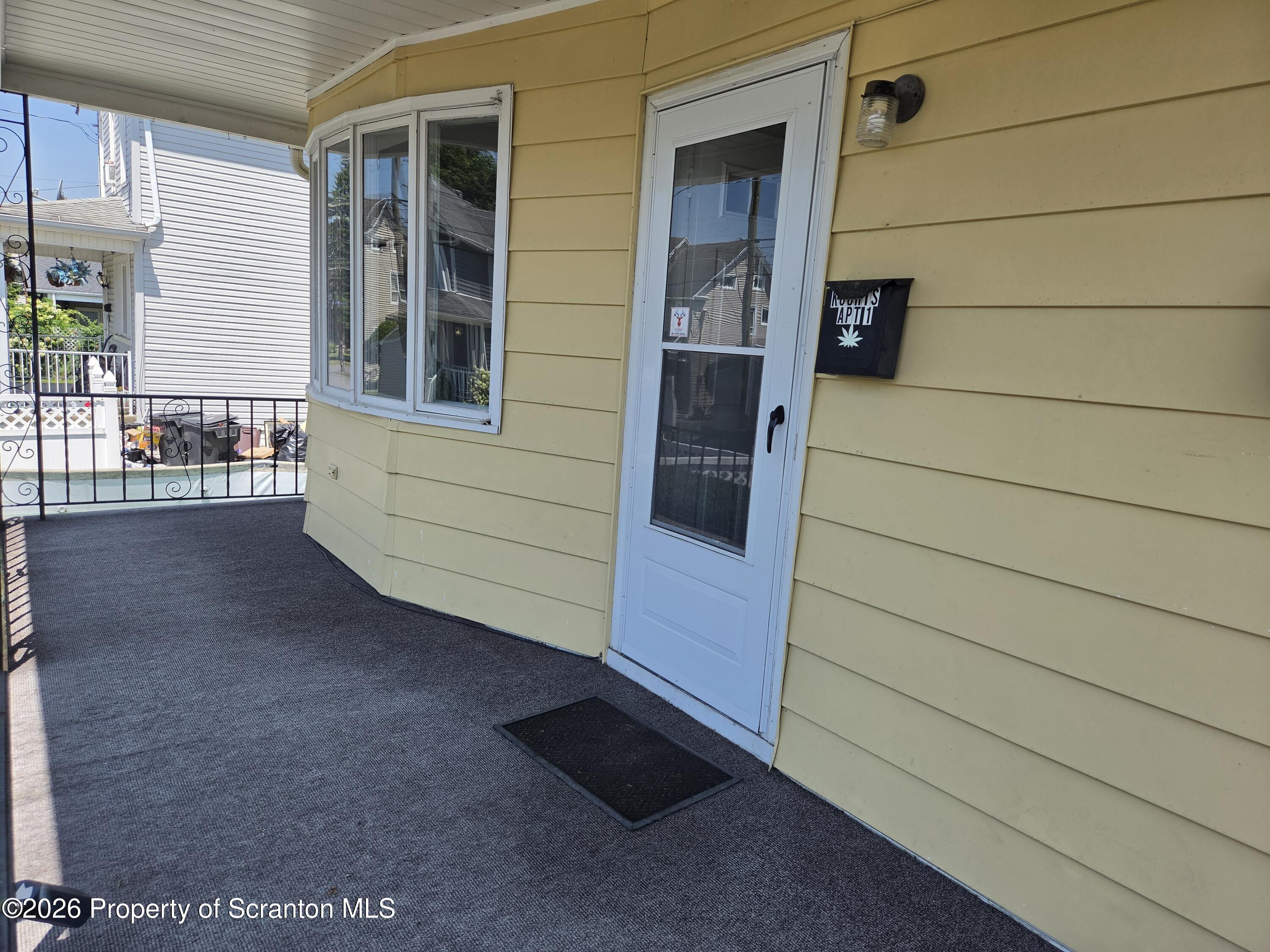 409 Butler Street Dunmore, PA 18512 - Photo 30 of 33 Covered Porch area