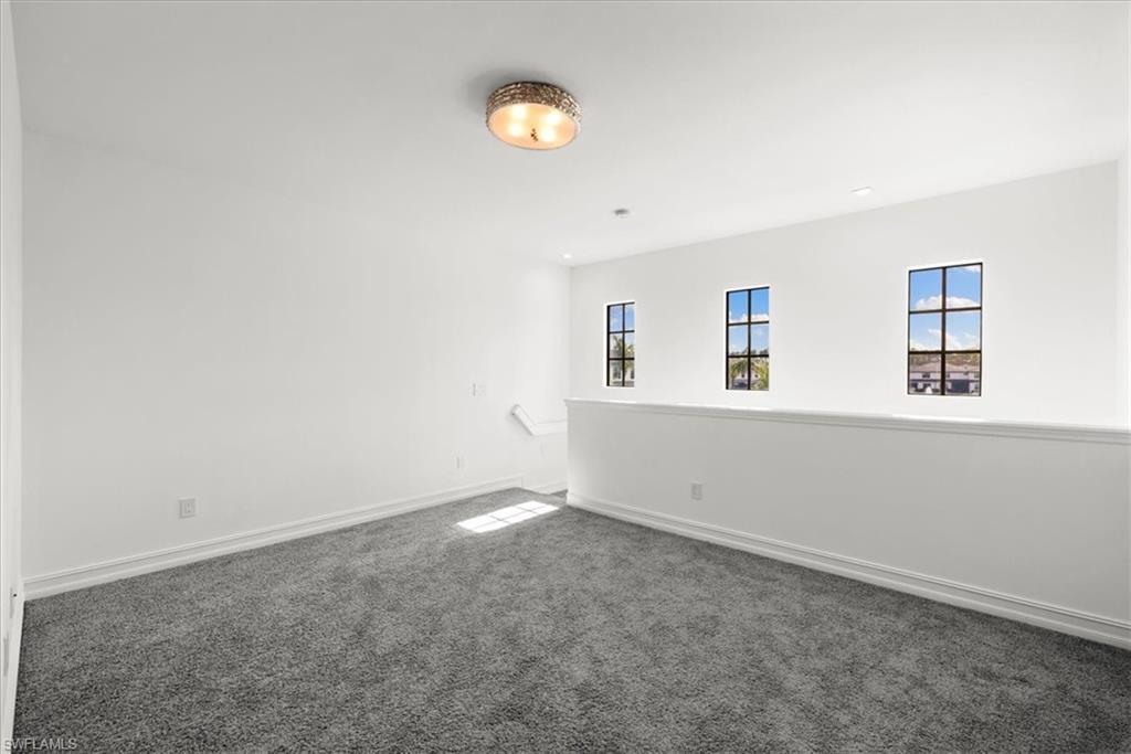 7622 Rockefeller Drive Naples, FL 34119 - Photo 13 of 40 an empty room with a window