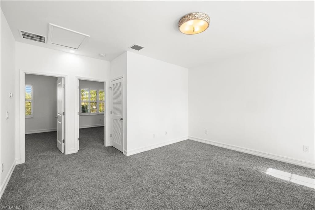 7622 Rockefeller Drive Naples, FL 34119 - Photo 16 of 40 a view of a room with furniture and window