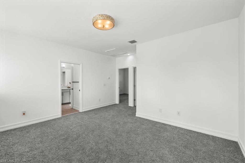7622 Rockefeller Drive Naples, FL 34119 - Photo 17 of 40 a view of an empty room and a window