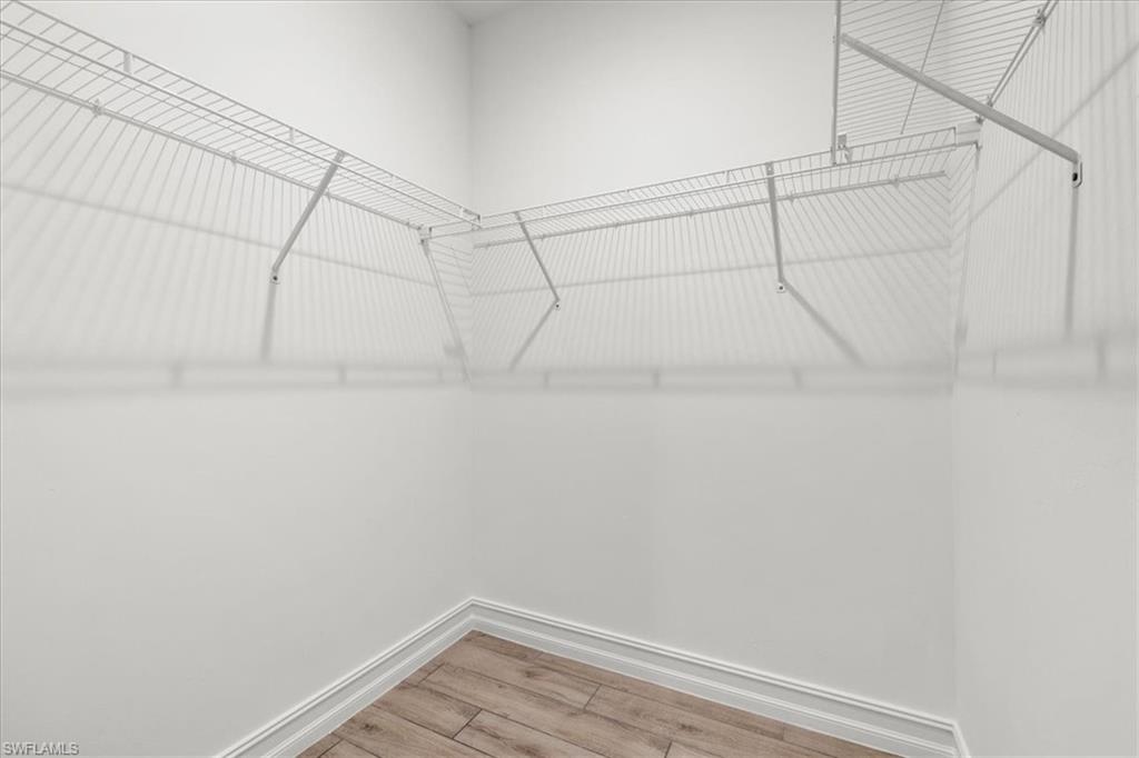 7622 Rockefeller Drive Naples, FL 34119 - Photo 28 of 40 a view of a room with racks on the wall