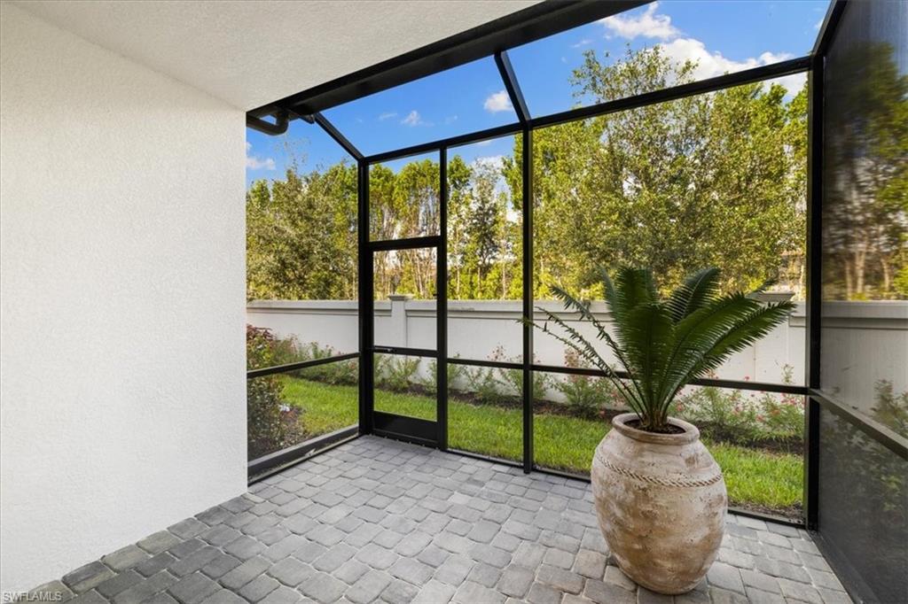 7622 Rockefeller Drive Naples, FL 34119 - Photo 30 of 40 a house view with a outdoor space